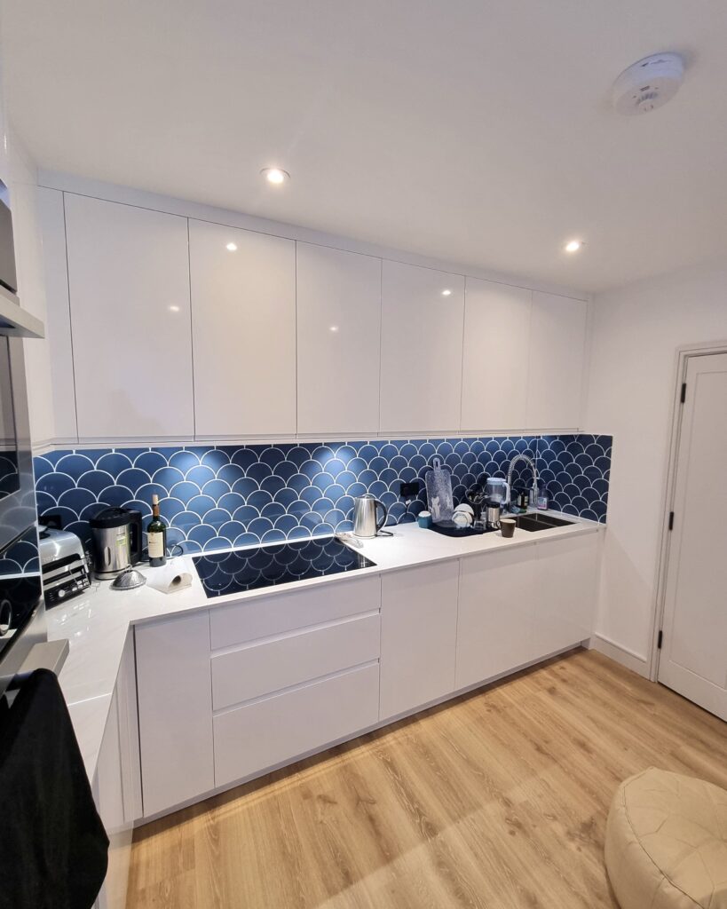 Modern White Kitchen with Blue Accent