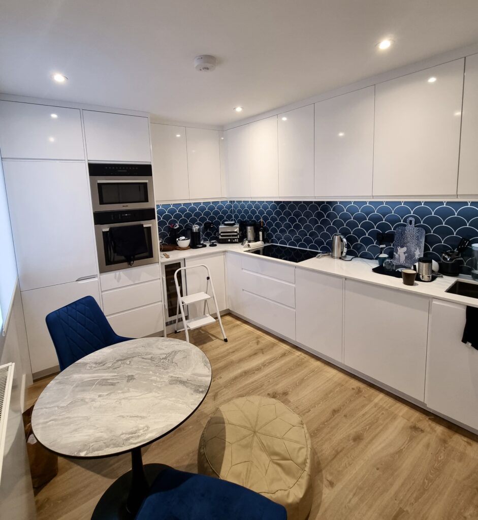 Modern White Kitchen with Blue Accent